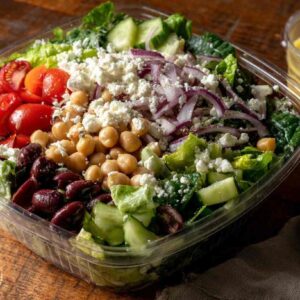 Costco Mediterranean Salad in plastic container with colorful toppings